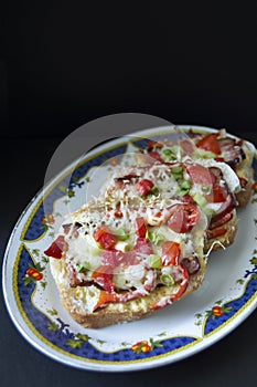 Tomato and bacon Bruschetta arranged on a plate