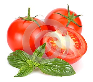 tomato with basil leaf isolated on white background