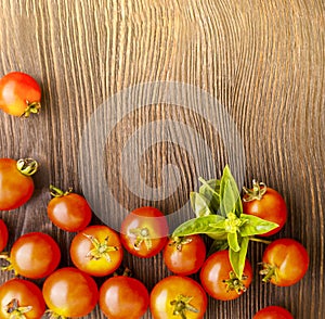 tomato with basil on wood table