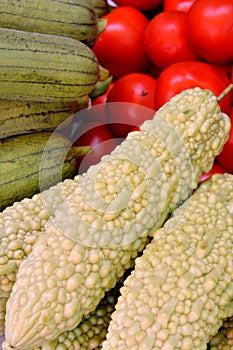 Tomato with bitter melon and towel gourd photo