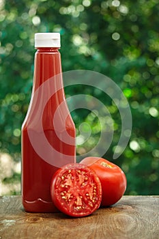 Tomato and bottle of ketchup