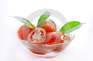 Tomato in bowl isolated on white