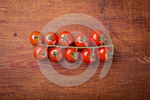 Tomato branch on vintage wood table