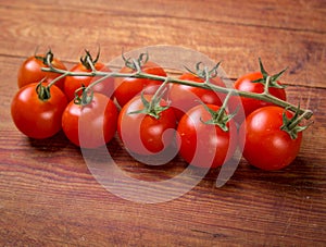 Tomato branch on vintage wood table