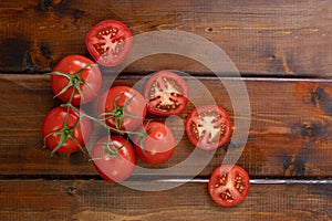 Tomato on a brown wooden background, top view, text space, fresh vegetables, space for text