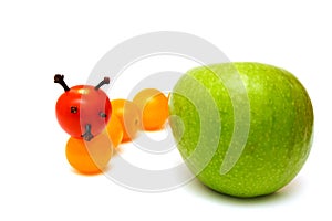 Tomato caterpillar with a green apple