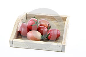 tomato color on wood tray.