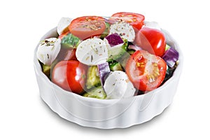 Tomato cucumber red onion mozzarella salad on a white isolated background