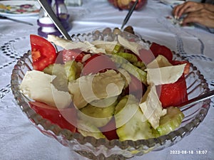 Tomato - cucumber salad with cheese