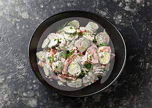 Tomato cucumber salad with dill, spring onion and sour cream