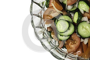 Tomato and cucumber salad. fresh chopped vegetables in a bowl. healthy vegetarian food