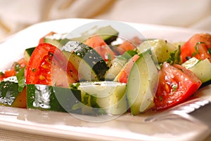 Tomato and cucumber salad with vinaigrette photo