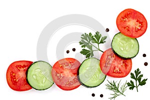 Tomato and cucumber slice with parsley dill and peppercorns isolated on white background with copy space for your text