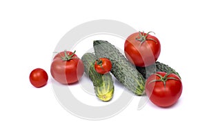 Tomato with cucumber on white background with clipping path. Ripe vegetables isolated on white background. Tomatoes, cucumber on i