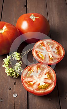 Tomato cut in half with oregano twig