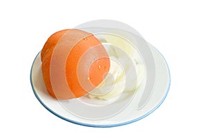 Tomato with drop of water half cut and slice onion on plate in white background