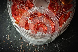 Tomato drying process in a food dehydrator.