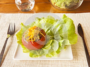 Tomato Filled with Vegetables and Beef Topped with Cheese