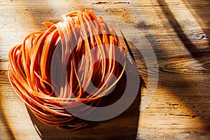 Tomato flavored linguine or tagliatelli pasta