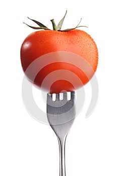 Tomato on fork