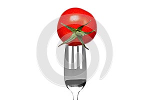 Tomato on a fork isolated on white