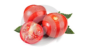 Tomato. Fresh Ripe natural tomatoes close-up. Organic tomato with leaves isolated on white background