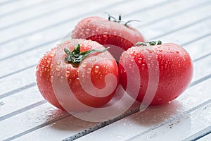 Tomato fruits on wooden table