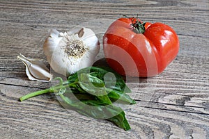 Tomato, Garlic and Basic on Wood Table