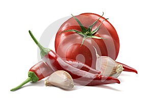 Tomato, garlic cloves, chili pepper isolated on white background