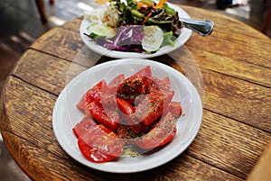 Tomato and green salad, pleasant meal photo