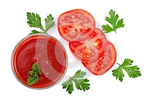 Tomato juice in glass and tomatoes with parsley leaves isolated on white background. Top view. Flat lay
