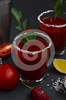 Tomato juice with salt. Bloody Mary cocktail with ingredients