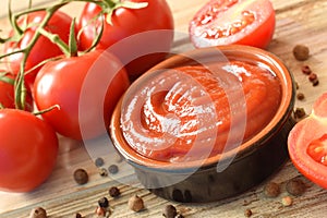 Tomato ketchup in bowl on table