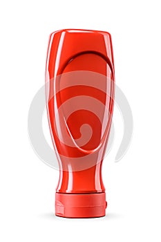 Tomato ketchup in red plastic upside down squeeze bottle isolated on a white