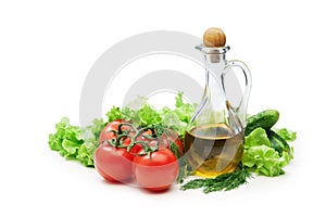 Tomato, lettuce salad and jug of vegetable oil