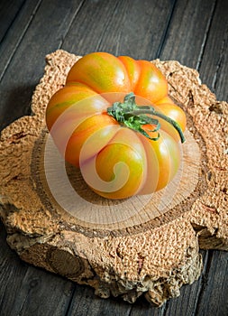 Tomato marmande on wooden table