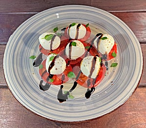 Tomato and mozzarella Caprese salad with sauce