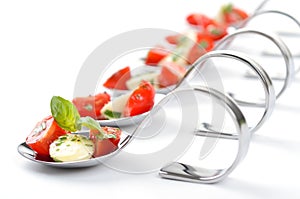 Tomato-mozzarella on spoon