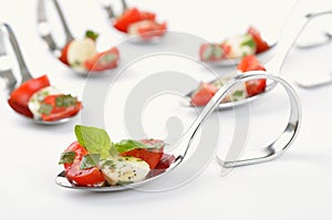 Tomato-mozzarella on spoon