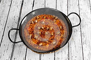 Tomato paella and Iberian secret with socarrat rice