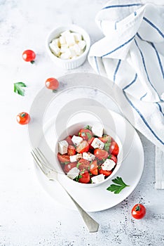 Tomato parsley Feta cheese salad in a bowl