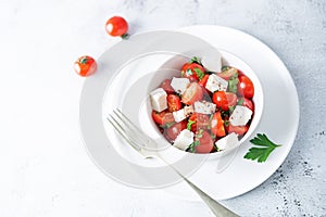 Tomato parsley Feta cheese salad in a bowl
