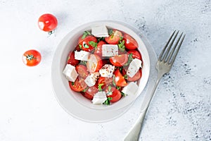 Tomato parsley Feta cheese salad in a bowl