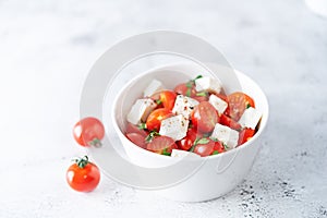 Tomato parsley Feta cheese salad in a bowl