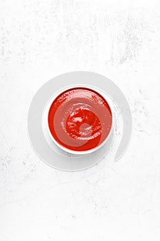 Tomato paste, sauce, ketchup with copy space on white background, top view