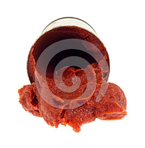 Tomato paste spilling from can