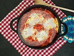 Tomato and poached eggs