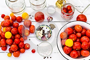 Tomato prepared for preservation on a white wooden background