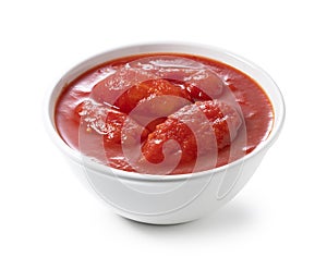 Tomato puree in a white bowl photo