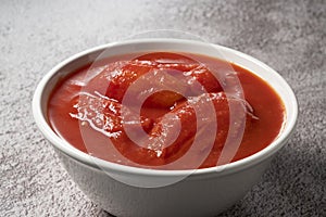 Tomato puree in a white bowl